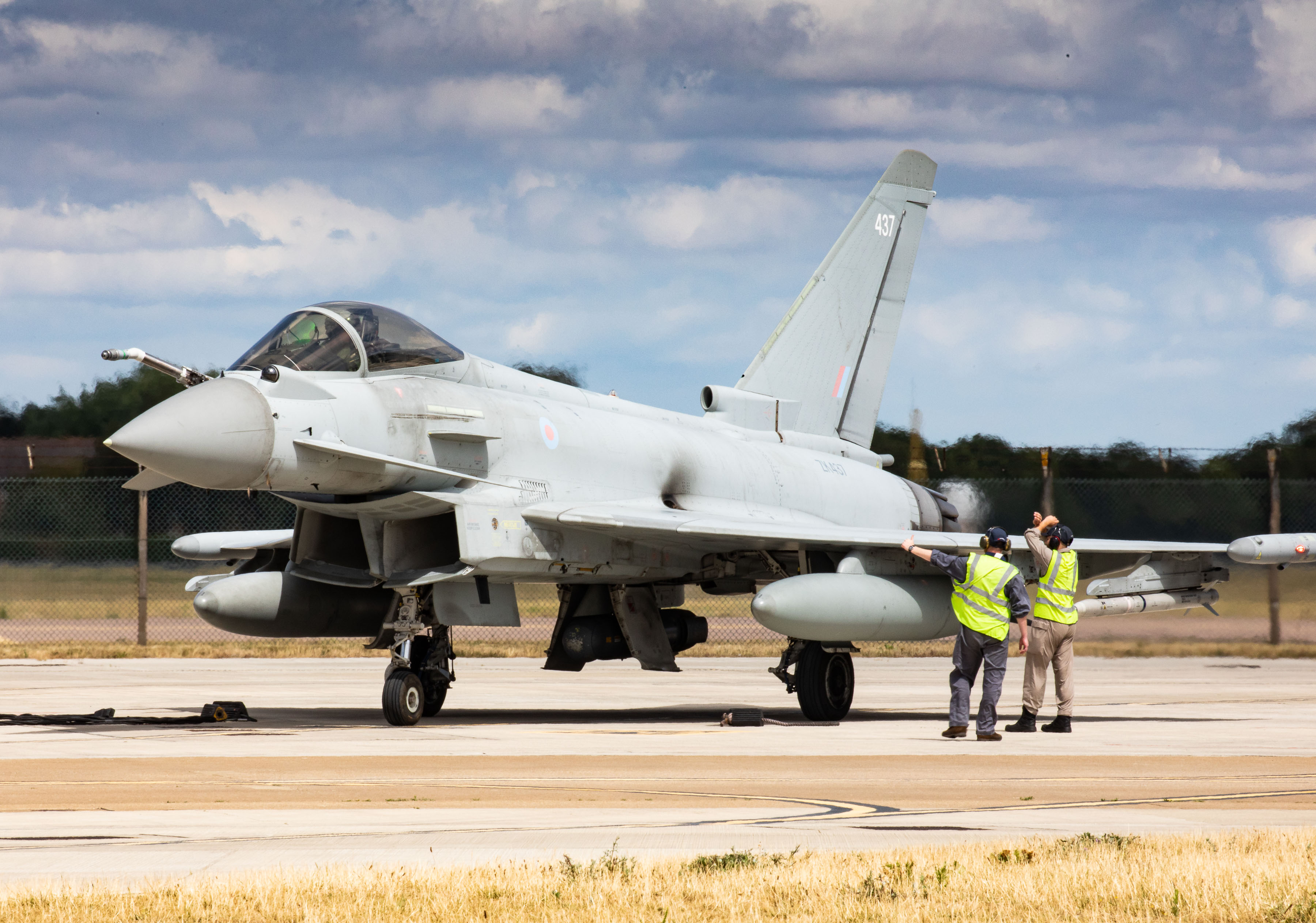 Image shows Typhoon on the airfield with ground crew.
